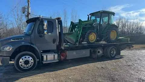 Equipment Hauling Lake in the Hills